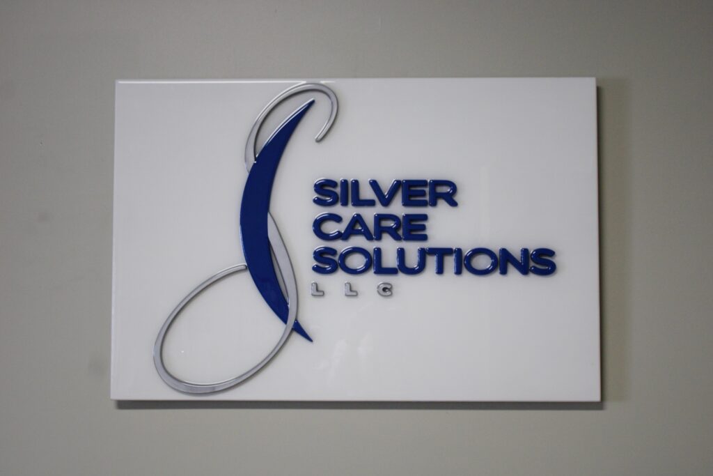 Silvercare solutions llc logo on interior sign
